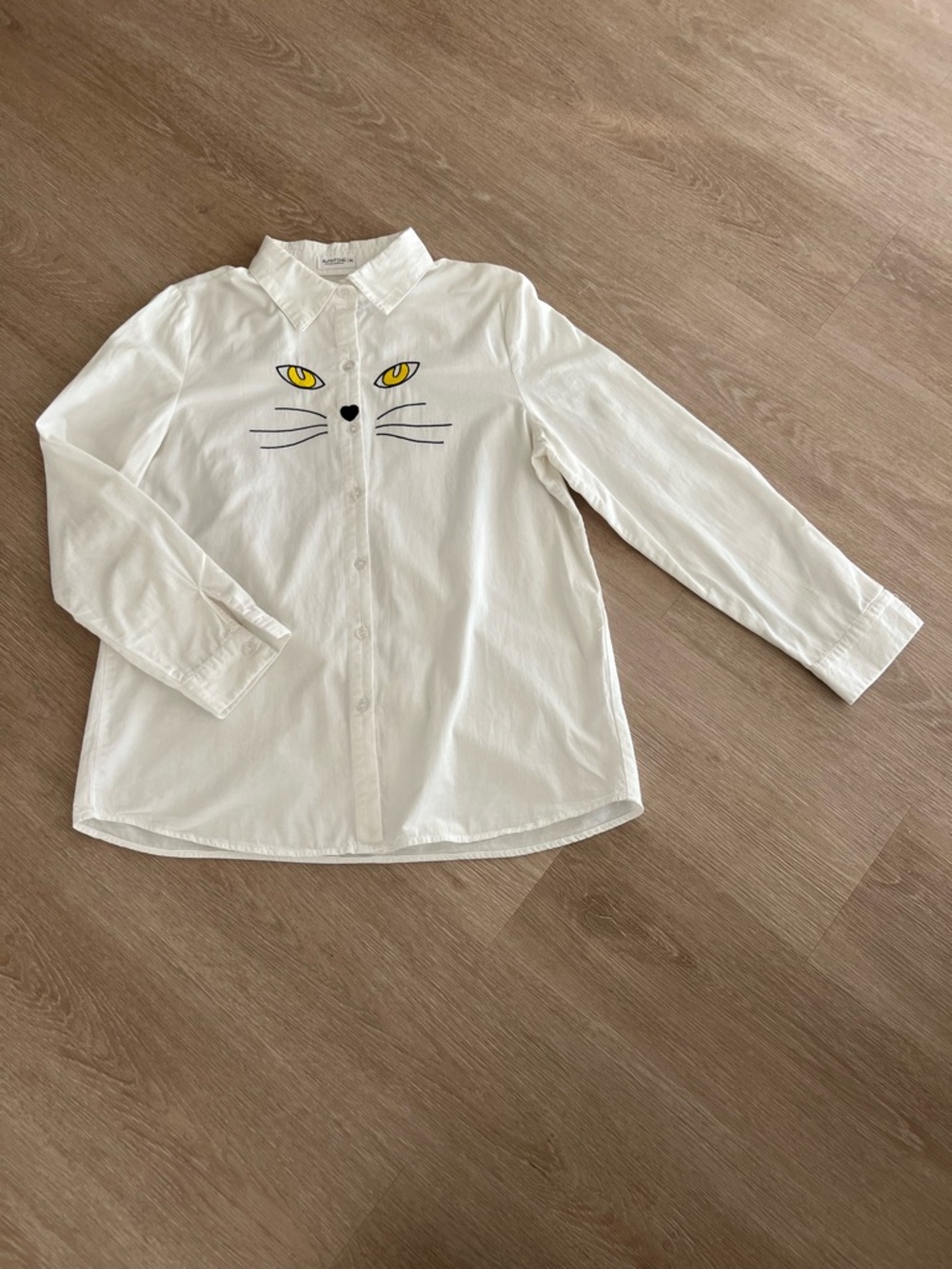 White Cat Face Button-Up Shirt with Yellow Eyes